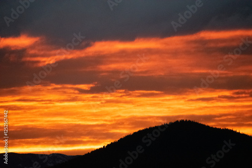 Orange Skies at Sunset Over The Rocky Mountains