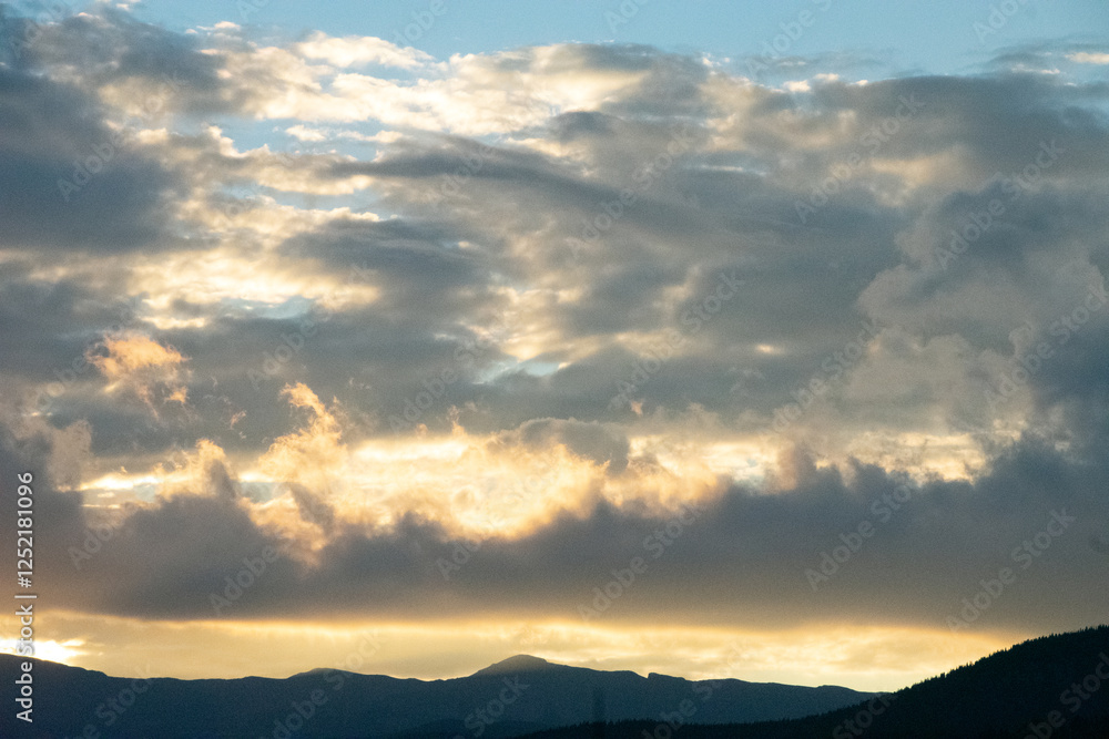 Glowing Clouds at Sunset Over Rocky Mountains Glowing Clouds at Sunset Over Rocky Mountains