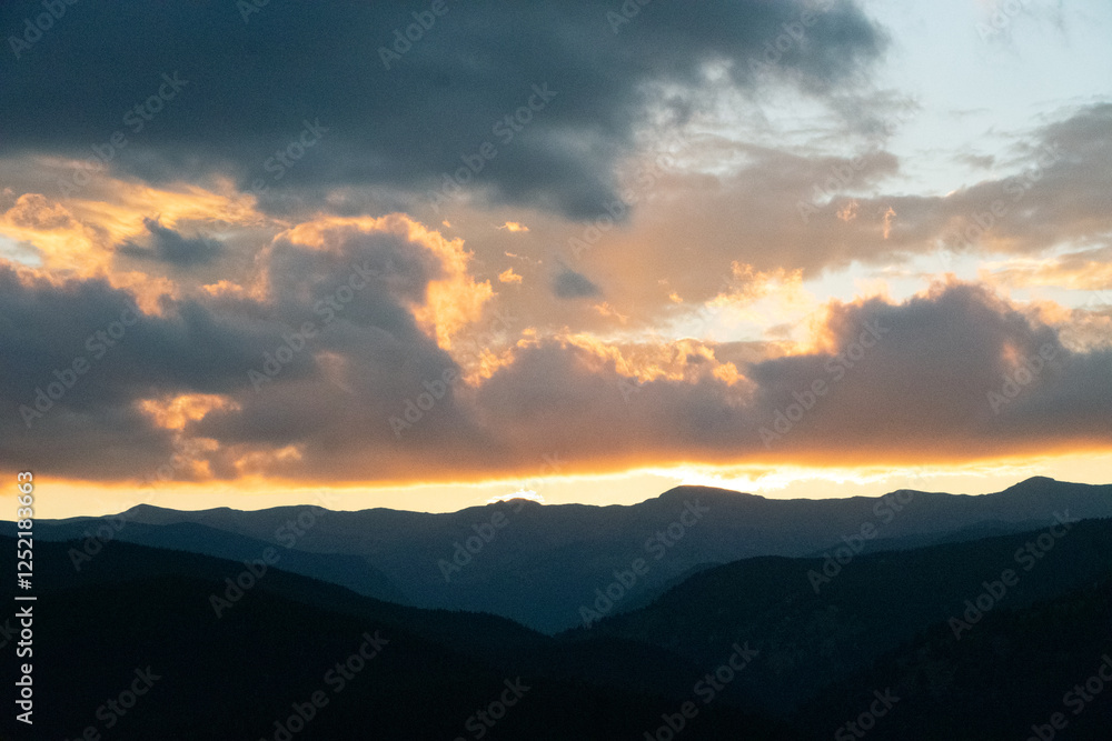 Glowing Clouds at Sunset Over Rocky Mountains Glowing Clouds at Sunset Over Rocky Mountains