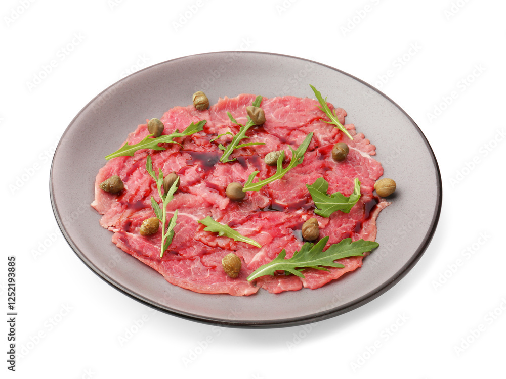 Fresh beef carpaccio with arugula, capers and sauce isolated on white Fresh beef carpaccio with arugula, capers and sauce isolated on white