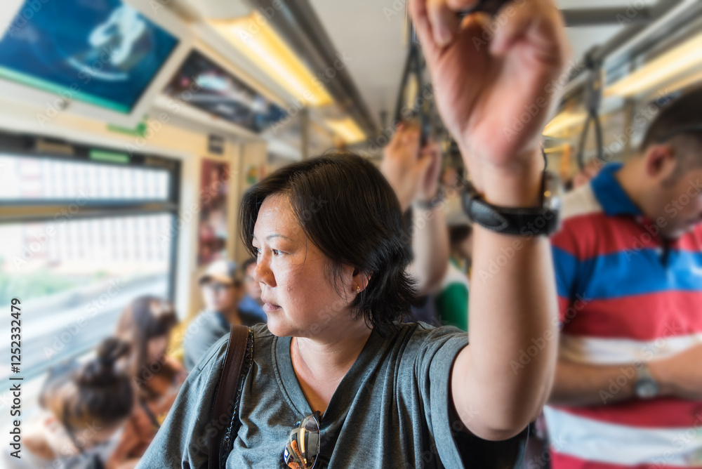 Asian woman travel on skytrain train in city Asian woman travel on skytrain train in city