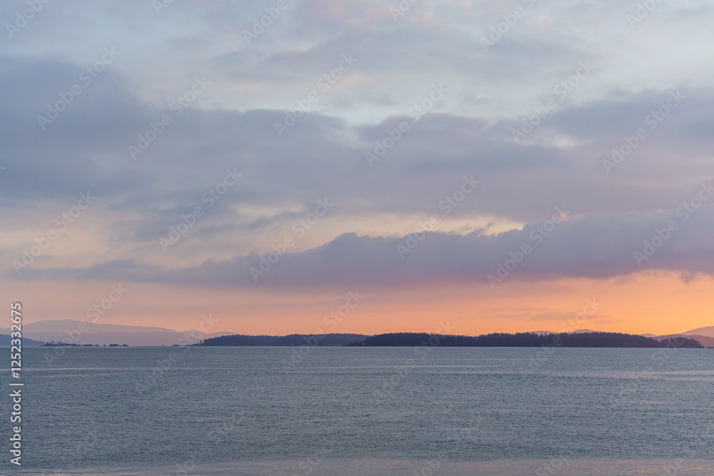 Gorgeous Ocean Sunset with Scenic Islands and Distant Mountains