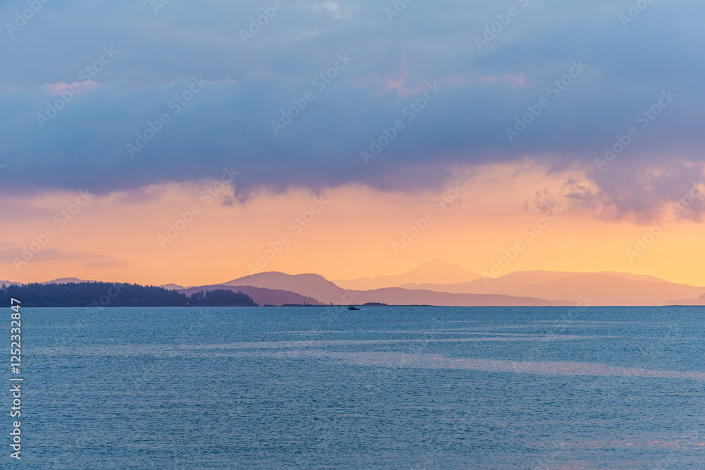 Vibrant Sunset Over Coastal Waters and Distant Islands Vibrant Sunset Over Coastal Waters and Distant Islands