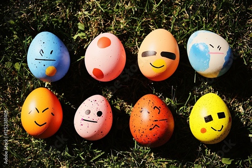 Eight Easter Eggs with Painted Emojis on Grass photo