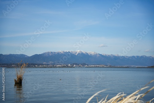 冬の雪化粧した比良山と琵琶湖 photo