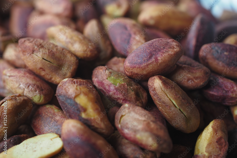Dry roasted cacao beans in a close-up view showcasing texture Dry roasted cacao beans in a close-up view showcasing texture