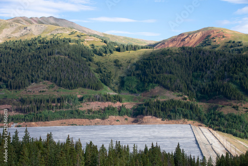 Tailing pond with mountains in the background