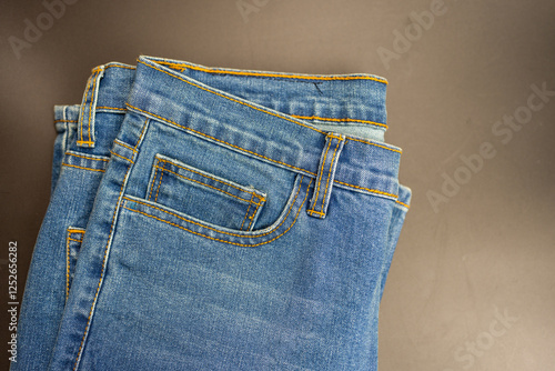 Stylish light blue jeans, closeup of inset pocket. Small jeans pocket