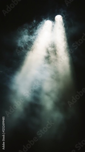 Dramatic light beams cutting through fog in a dimly lit space during an eveni...