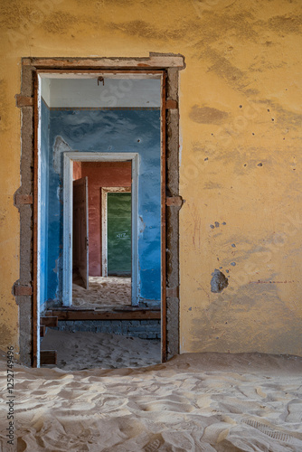 The long abandoned buildings of the mining town of Kolmanskop, Namibia. Located near to Luderitz photo