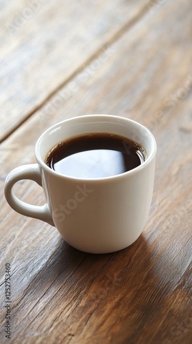 Warm coffee cup resting on wooden table in a cozy caf setting during morning ...