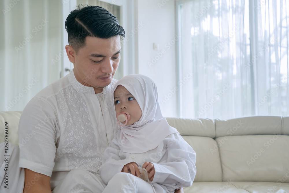 Muslim Father Comforting His Young Daughter at Home Muslim Father Comforting His Young Daughter at Home