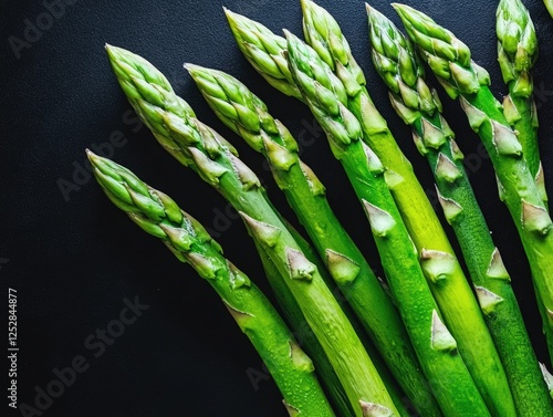 Asparagus stems in a bunch with green tips, showcasing freshness and vibrant color. photo