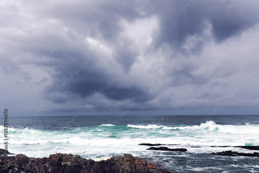 Fototapeta premium Large Indian Ocean waves and rocky coastline in Tsitsikamma, Garden Route National Park, Eastern Cape. South Africa 