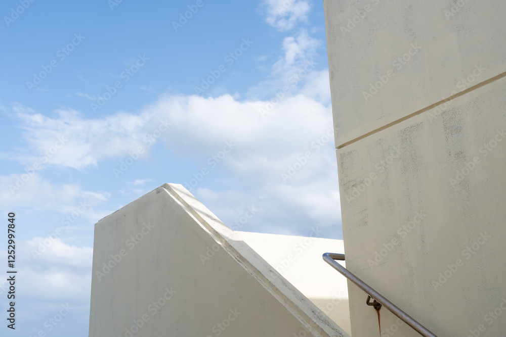 Minimalist Staircase against a Blue Sky, Miyakojima, Japan Minimalist Staircase against a Blue Sky, Miyakojima, Japan