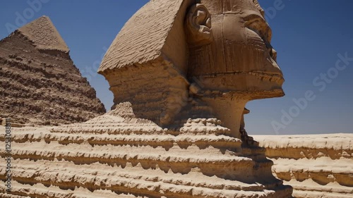 The Great Sphinx of Giza and Pyramids of Khafre | Smooth Gentle Camera Movements | Highlighting Majestic Ancient Details | Serene and Timeless Desert Landscape | Warm Golden Sunlight Casting Shadows |