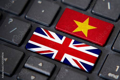 UK and Vietnam flags on computer keyboard