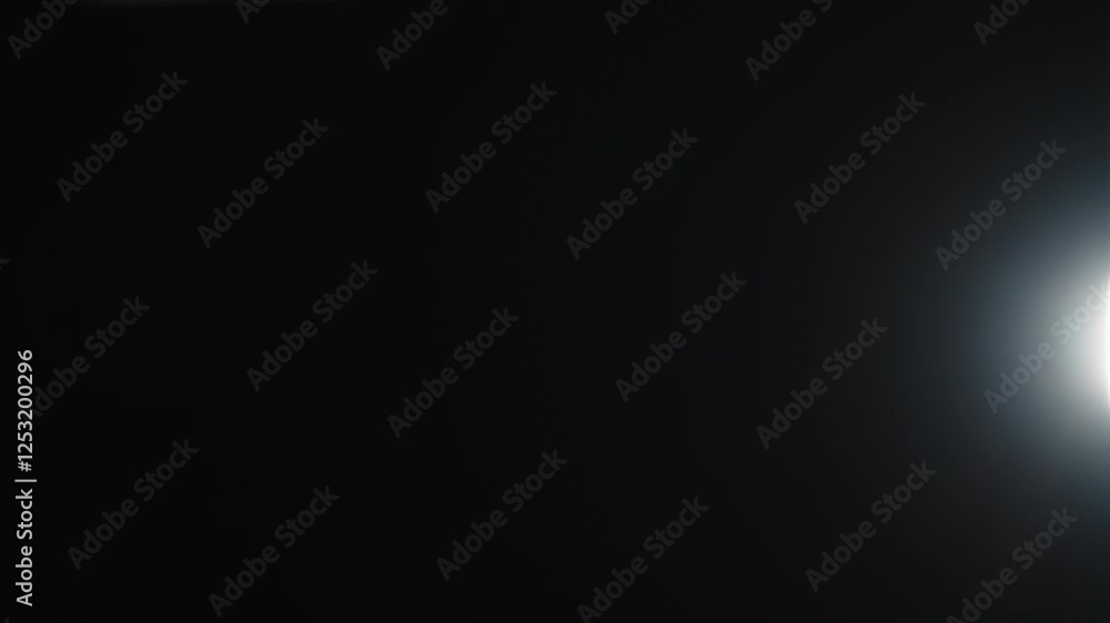 Real optic lens flare over black background for overlay or background Real optic lens flare over black background for overlay or background