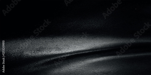 Texture of natural black leather with folds. Eco-friendly leatherette, artificial leather. Wallpaper, background, copy space