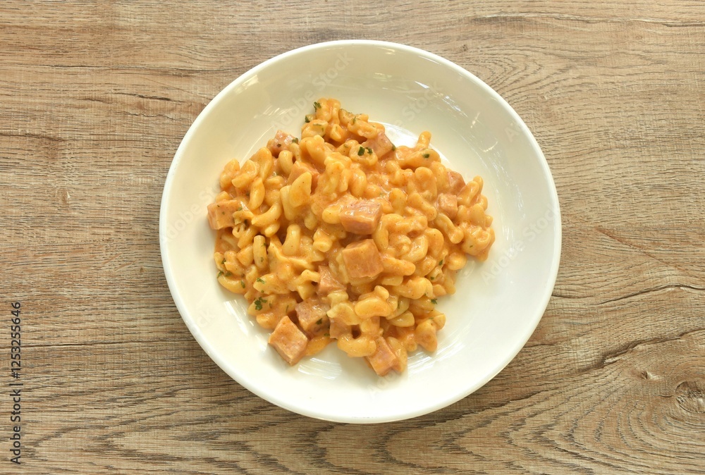baking macaroni and slice ham pork sausage with cheese on plate baking macaroni and slice ham pork sausage with cheese on plate