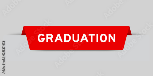 Red color inserted label with word graduation on gray background