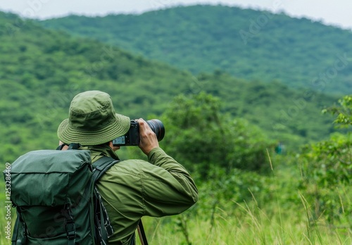 Wallpaper Mural Photographer Capturing Scenic Landscape in Lush Green Wilderness Torontodigital.ca