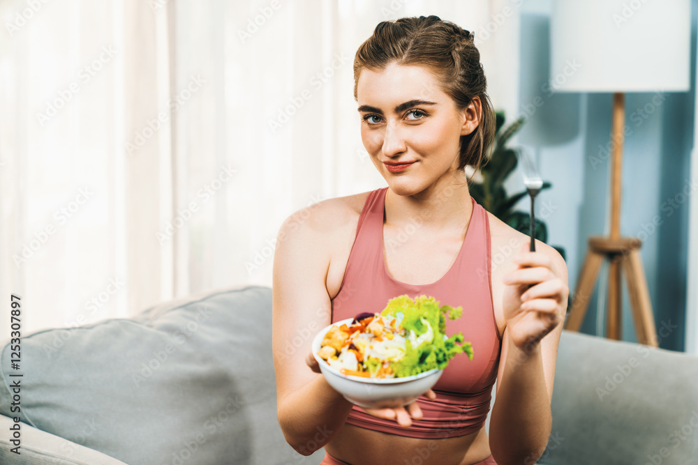 Healthy sporty and vegetarian woman in sportswear with a bowl of fruit and vegetable. Healthy cuisine nutrition and vegan lifestyle for fitness body physique at gaiety home concept. Healthy sporty and vegetarian woman in sportswear with a bowl of fruit and vegetable. Healthy cuisine nutrition and vegan lifestyle for fitness body physique at gaiety home concept.