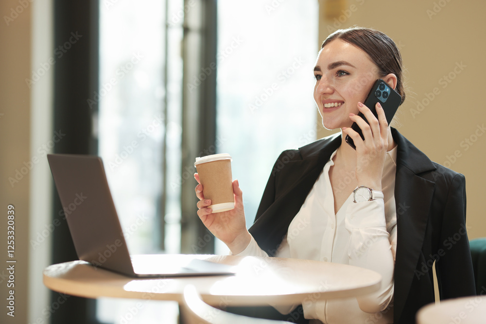 Woman in stylish formal suit working at table indoors Woman in stylish formal suit working at table indoors