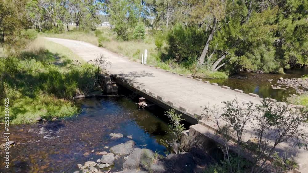 River in the forest looking at a Cement bridge on the Severn River at Strathbogie, NSW, Australia River in the forest looking at a Cement bridge on the Severn River at Strathbogie, NSW, Australia