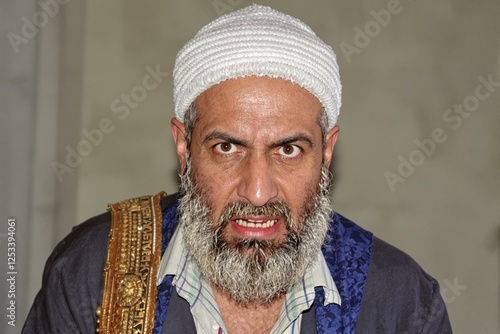 Intense Expression of a Devout Muslim photo