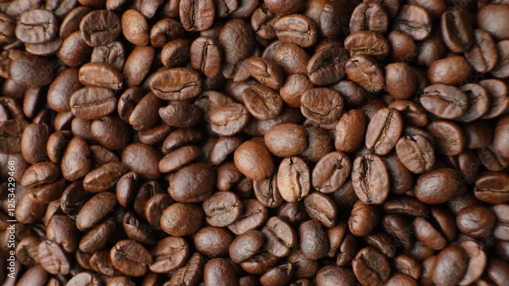 Rotating a caffeine-free decaf coffee beans close-up top view Rotating a caffeine-free decaf coffee beans close-up top view