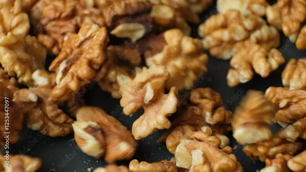 Walnut kernels falling, slow motion macro. Walnut kernels falling, slow motion macro.
