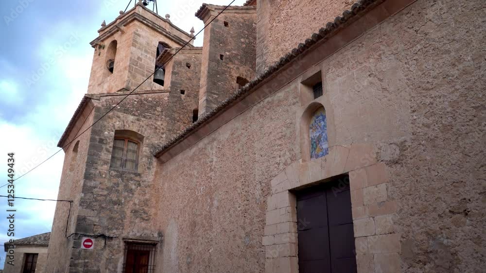 Old church in Montesa town, on a cloudy morning day. Old church in Montesa town, on a cloudy morning day.