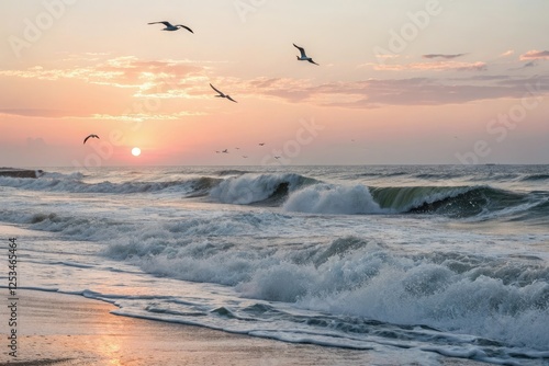 Ocean waves crashing against the shore while the sun rises over the horizon with a few sea birds flying overhead, water, ocean