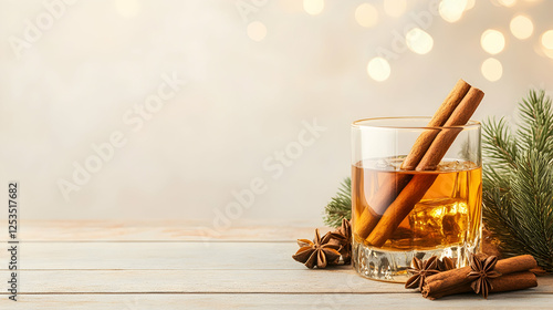 Festive drink with cinnamon sticks on a table, Christmas mood, for holiday menus or promotional materials photo