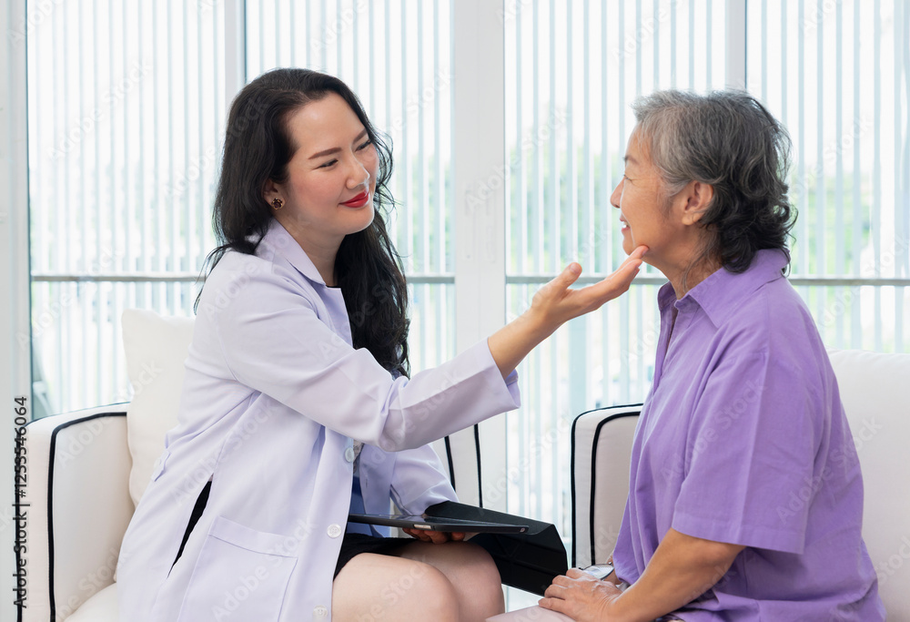 Obraz premium cosmetic surgeon,one hand holding tablet,other hand touching senior woman face to check her facial skin condition for treatment at aesthetic clinic