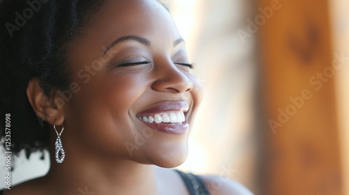 A joyful woman smiles warmly, radiating happiness and positivity. Free Download A joyful woman smiles warmly, radiating happiness and positivity. - GFXLoad