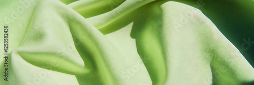 Light lime green cotton fabric showcasing a smooth poplin weave for vibrant textile designs