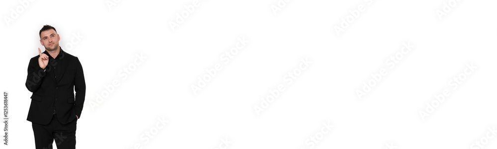 A handsome dark-haired man wearing a business suit, a black shirt on a white background