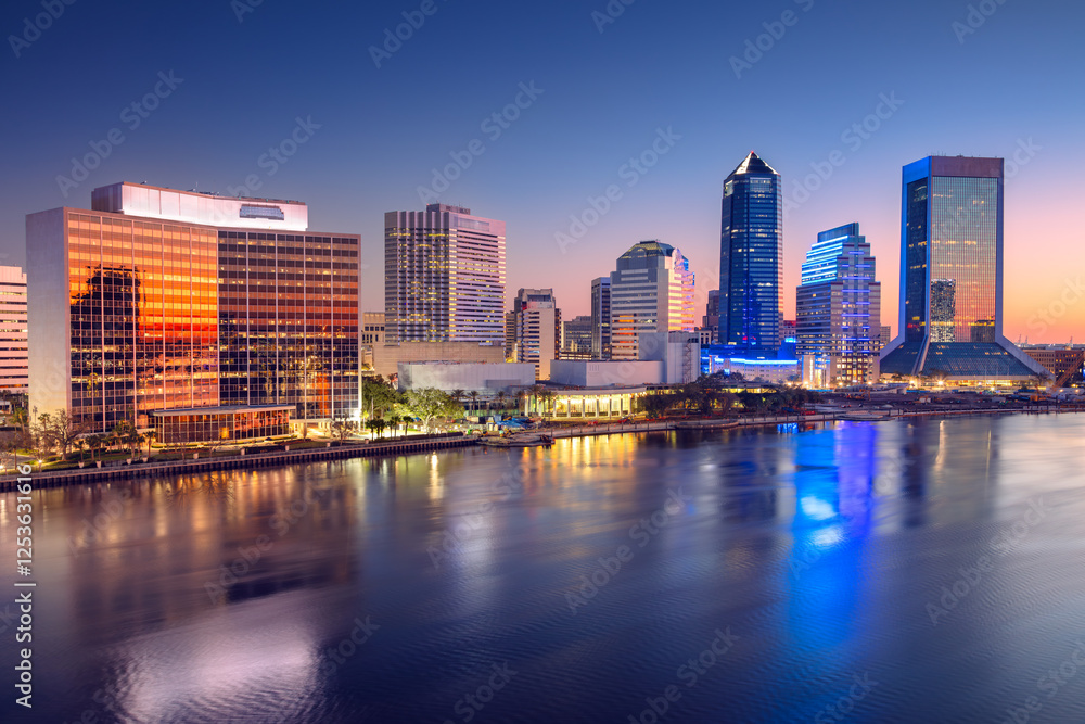 Jacksonville, Florida, USA. Cityscape image of Jacksonville, Florida with reflection of the city skyline in the water at beautiful sunrise.