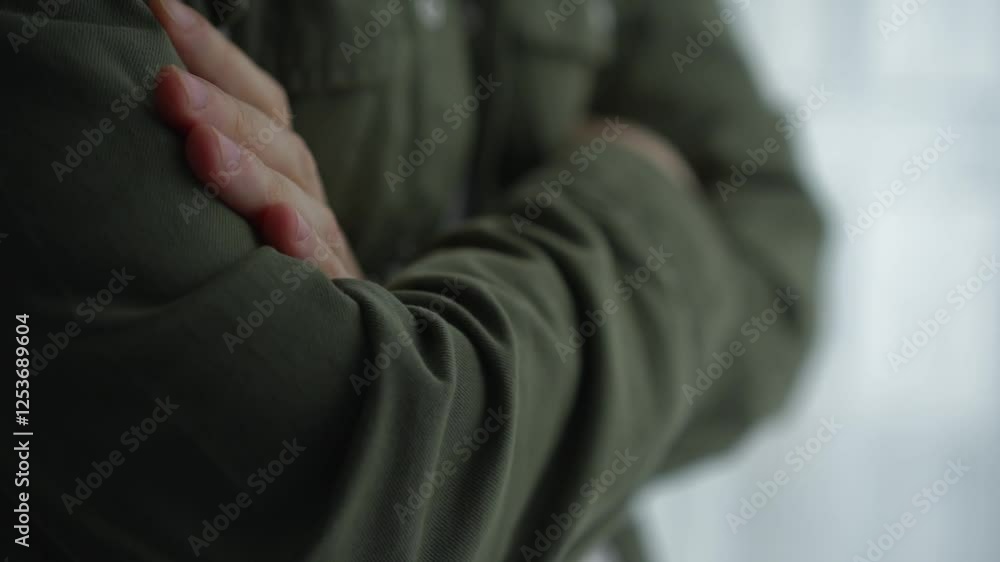 The man crossed his arms over his chest.
A man in a closed pose.
A man with his arms folded on his chest.
Gesture of a business and confident man.
A man in a green shirt holds his hands on his chest The man crossed his arms over his chest.
A man in a closed pose.
A man with his arms folded on his chest.
Gesture of a business and confident man.
A man in a green shirt holds his hands on his chest