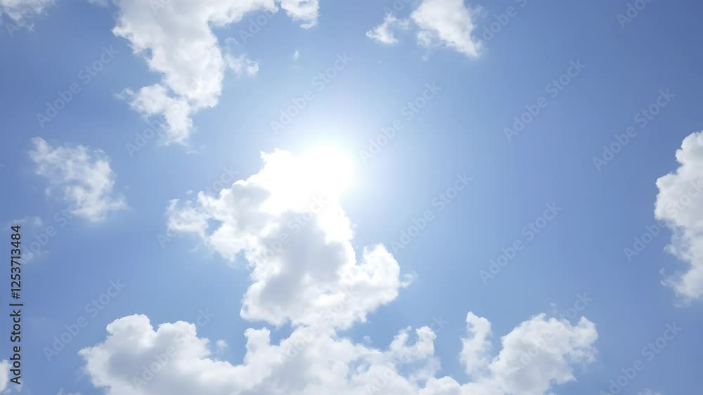 Bright blue sky with fluffy white clouds, creating a serene and peaceful atmosphere. Bright blue sky with fluffy white clouds, creating a serene and peaceful atmosphere.