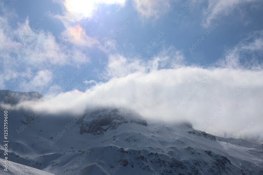 Snowy mountain clouds. High quality photo Snowy mountain clouds. High quality photo