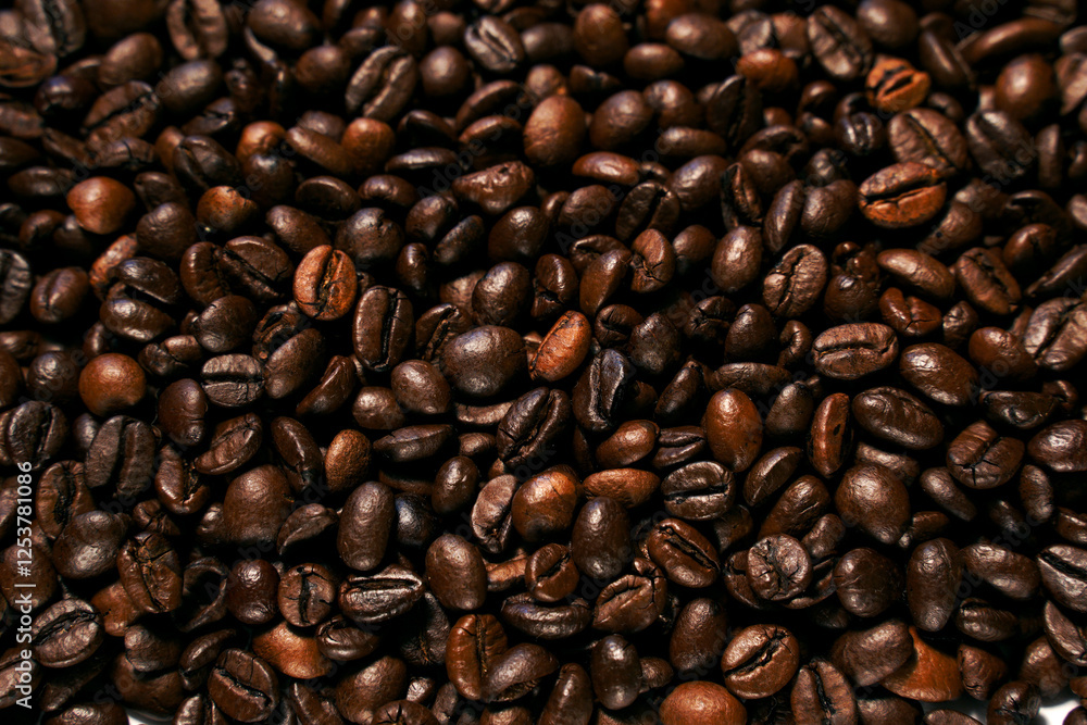 Fototapeta premium Aromatic roasted coffee beans textured background.