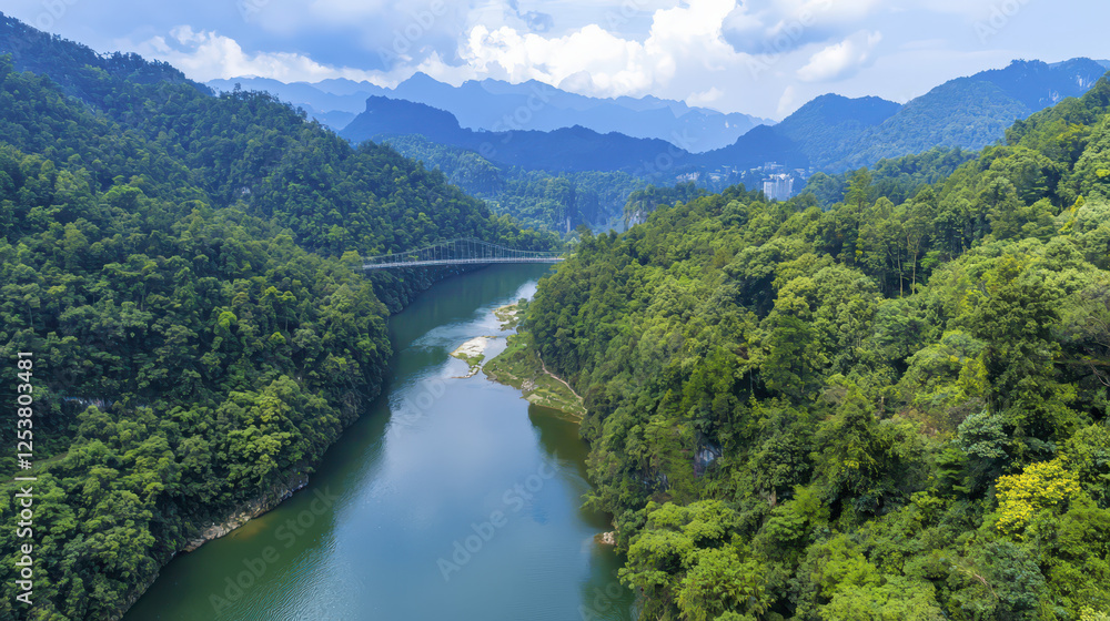 Aerial view of lush green valley with winding river and mountains Aerial view of lush green valley with winding river and mountains