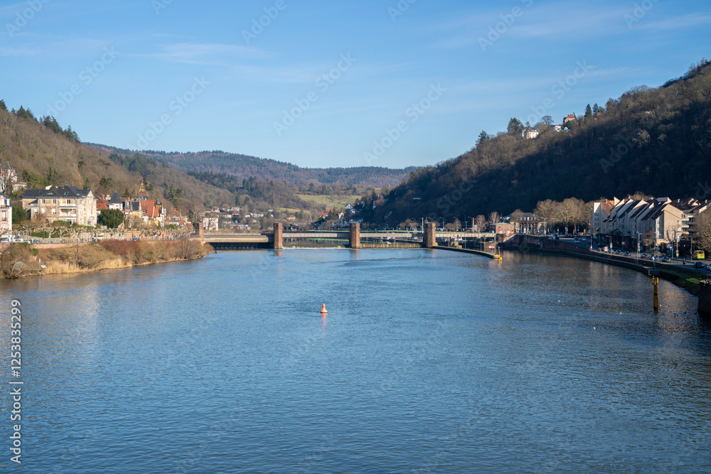 Fototapeta premium Heidelberg: Romantic city on the Neckar River, famous for its castle, historic old town, Germany’s oldest university, and picturesque scenery between the Neckar Valley and the Odenwald Forest