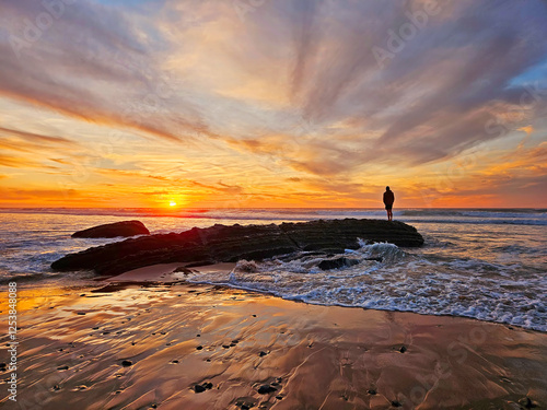 Beautiful sunset at Praia Vale Figueiras in Portugal photo