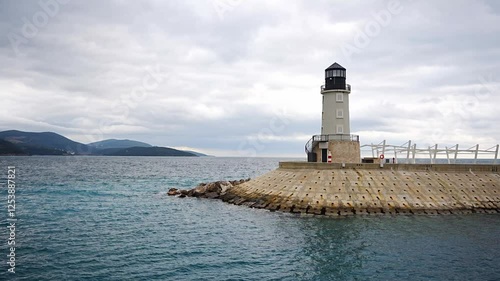 Lighthouse with a restaurant in Lustica Bay in winter time, Montenegro photo