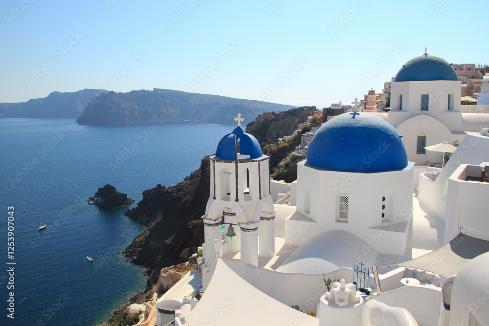 Fototapeta premium Caldera view from Oia, Santorini, from the famous viewpoint with the 3 blue doms