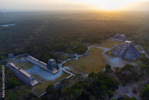  Aerial photography of Chichen Itza maya pyramid in mystic twilight jungle without people..